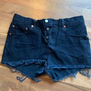 Never worn W30 dark blue denim Levi cutoffs.